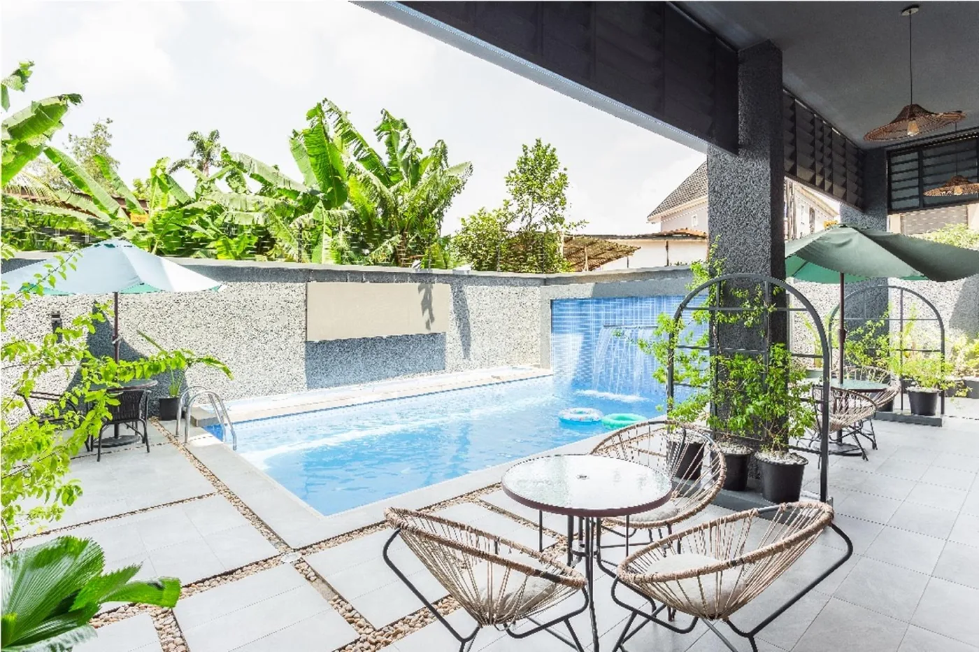 Private pool courtyard with lounge seating