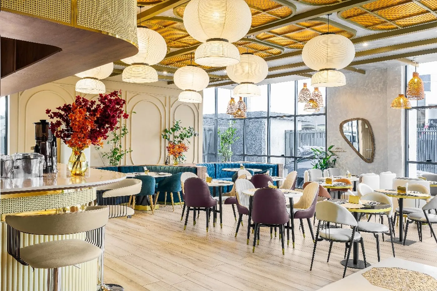 ROKA restaurant with teal banquettes and paper lantern lights